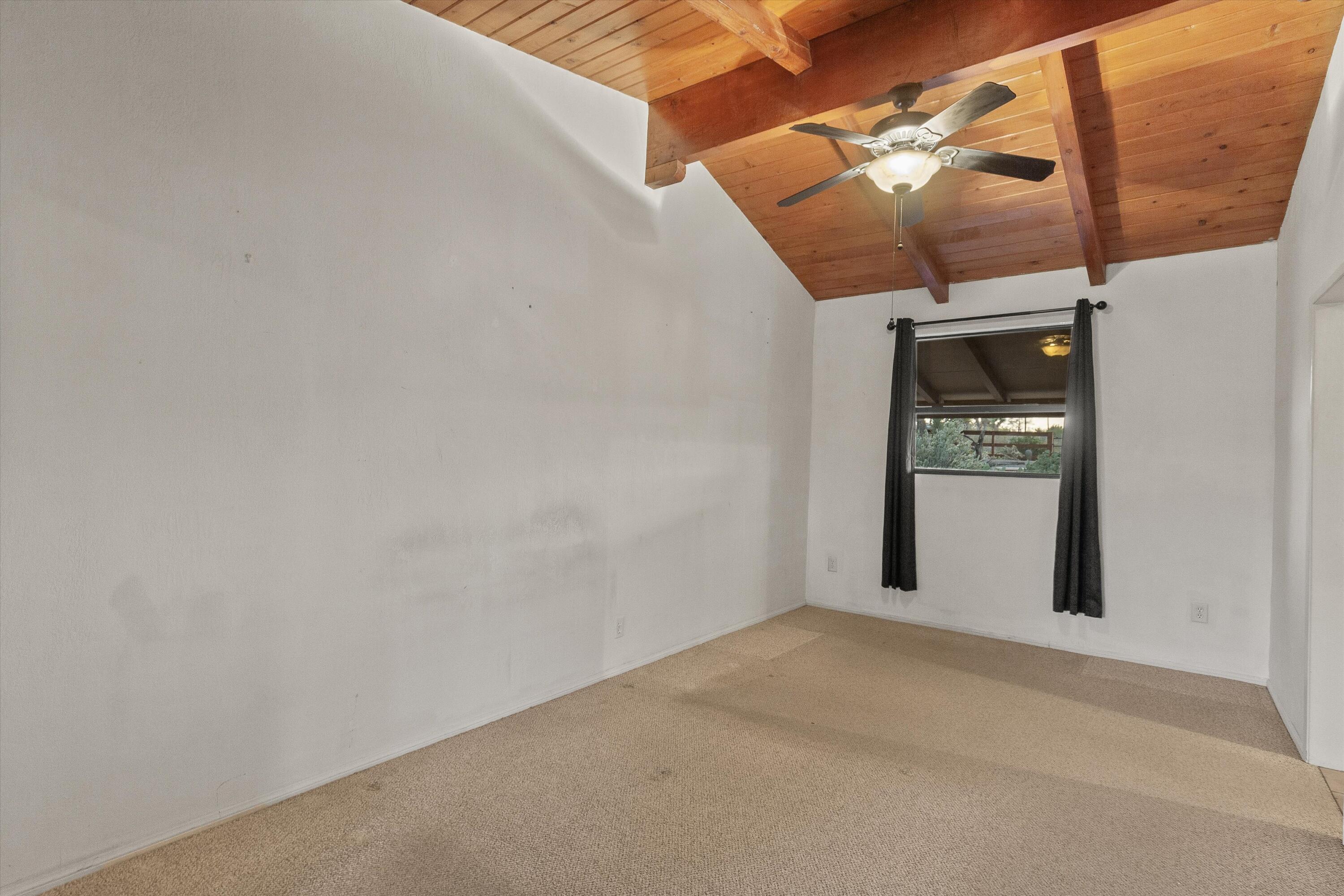 6785 Saddleback Road Joshua Tree, CA 92252 - Photo 26 of 50 an empty room with windows