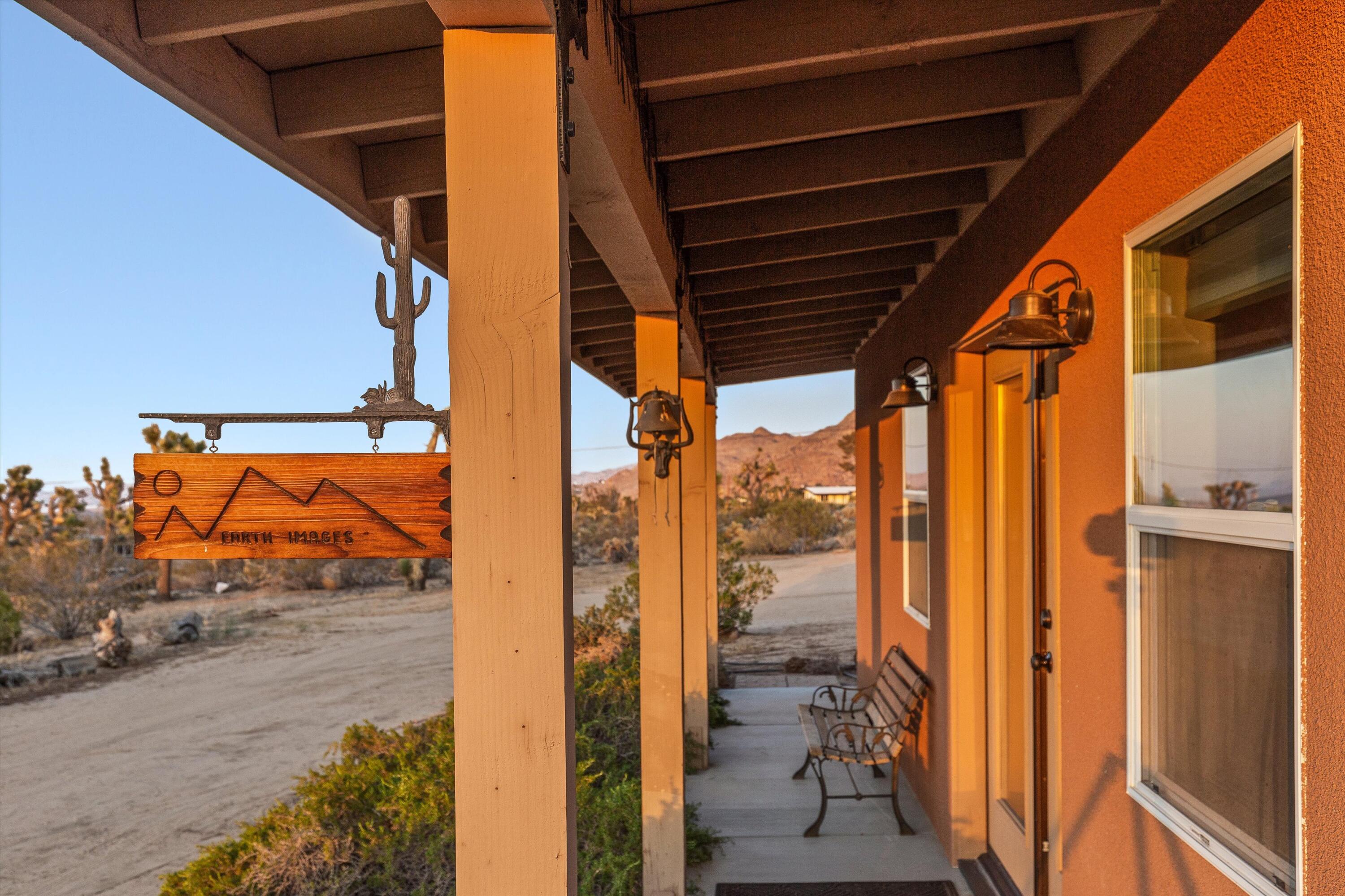 6785 Saddleback Road Joshua Tree, CA 92252 - Photo 36 of 50 a view of a door and a car porch