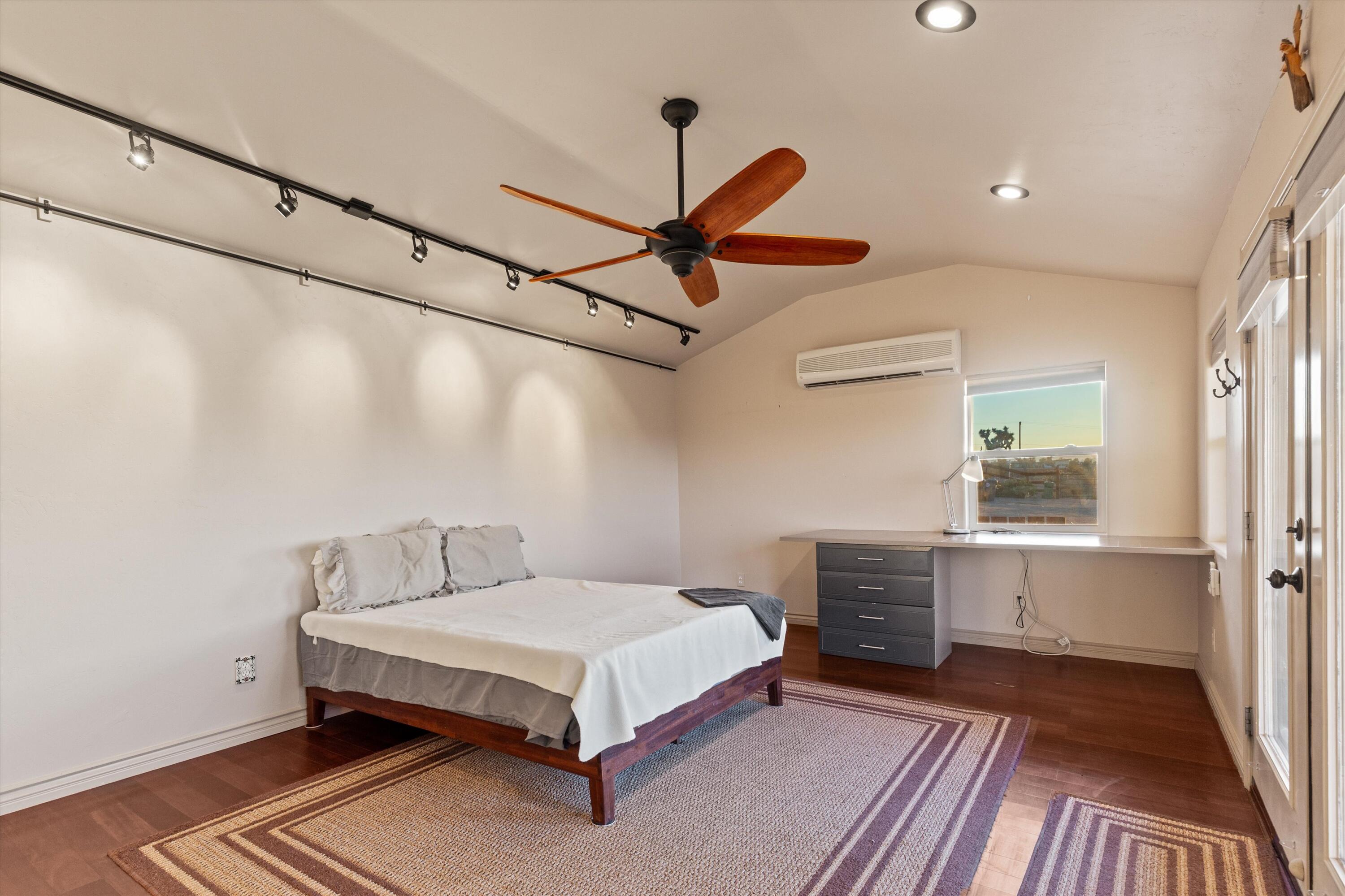 6785 Saddleback Road Joshua Tree, CA 92252 - Photo 38 of 50 a bedroom with a bed and a table