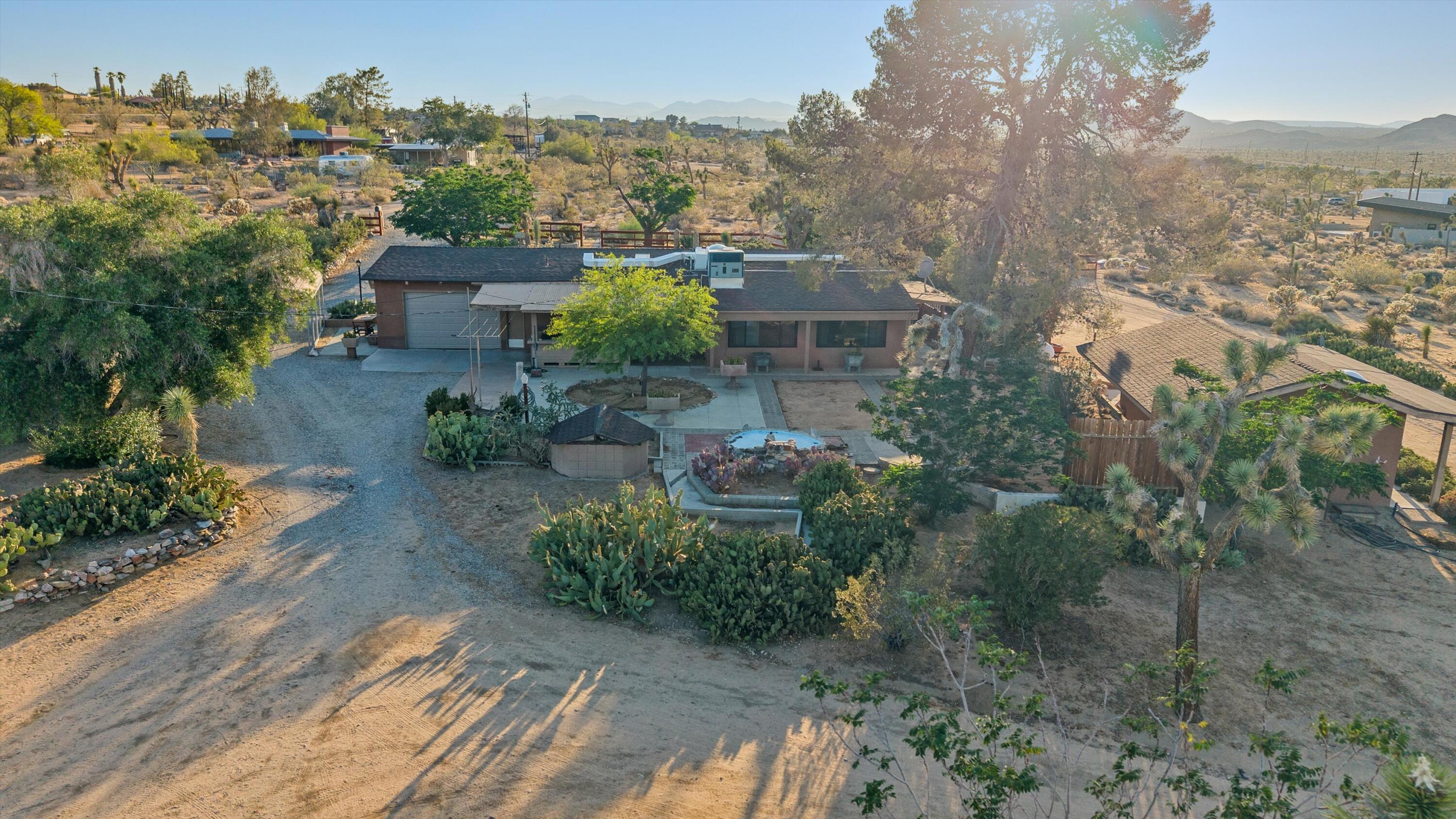 6785 Saddleback Road Joshua Tree, CA 92252 - Photo 41 of 50 an aerial view of a house with a yard