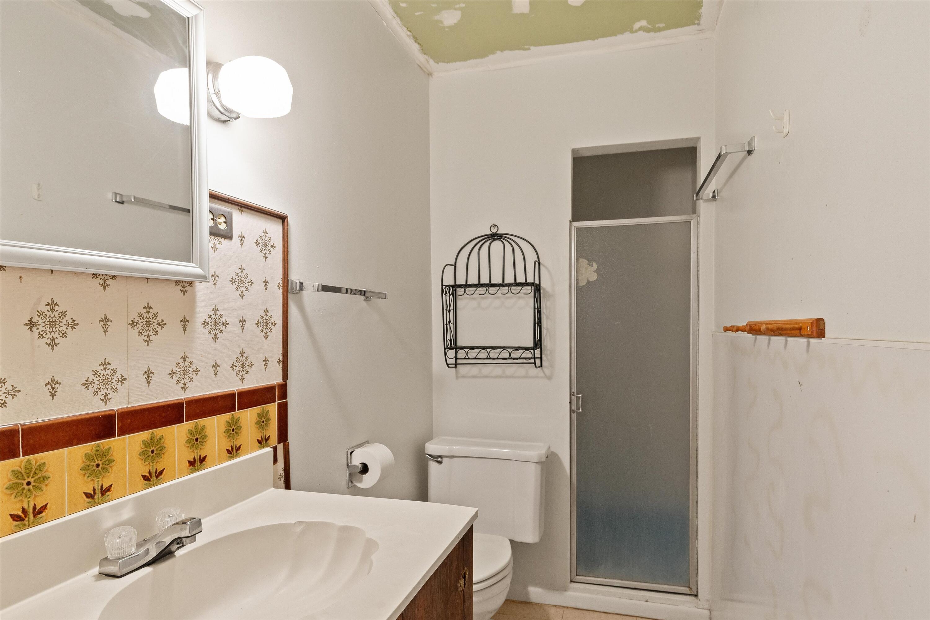 6785 Saddleback Road Joshua Tree, CA 92252 - Photo 46 of 50 a bathroom with a sink a toilet and shower