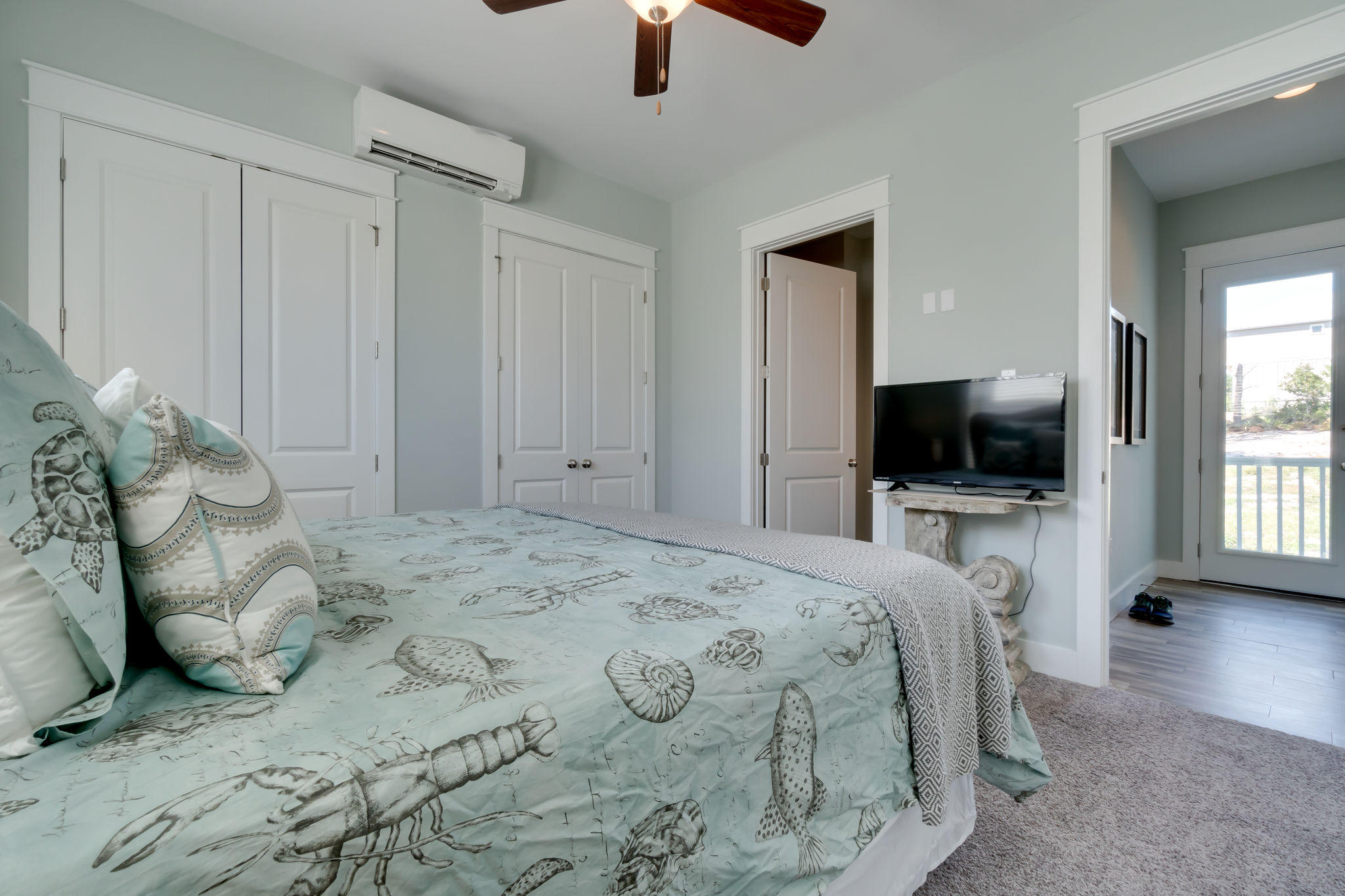 Lot 18 Beach View Dr Inlet Beach Inlet Beach, FL 32461 - Photo 18 of 41 a bedroom with a bed and a flat screen tv