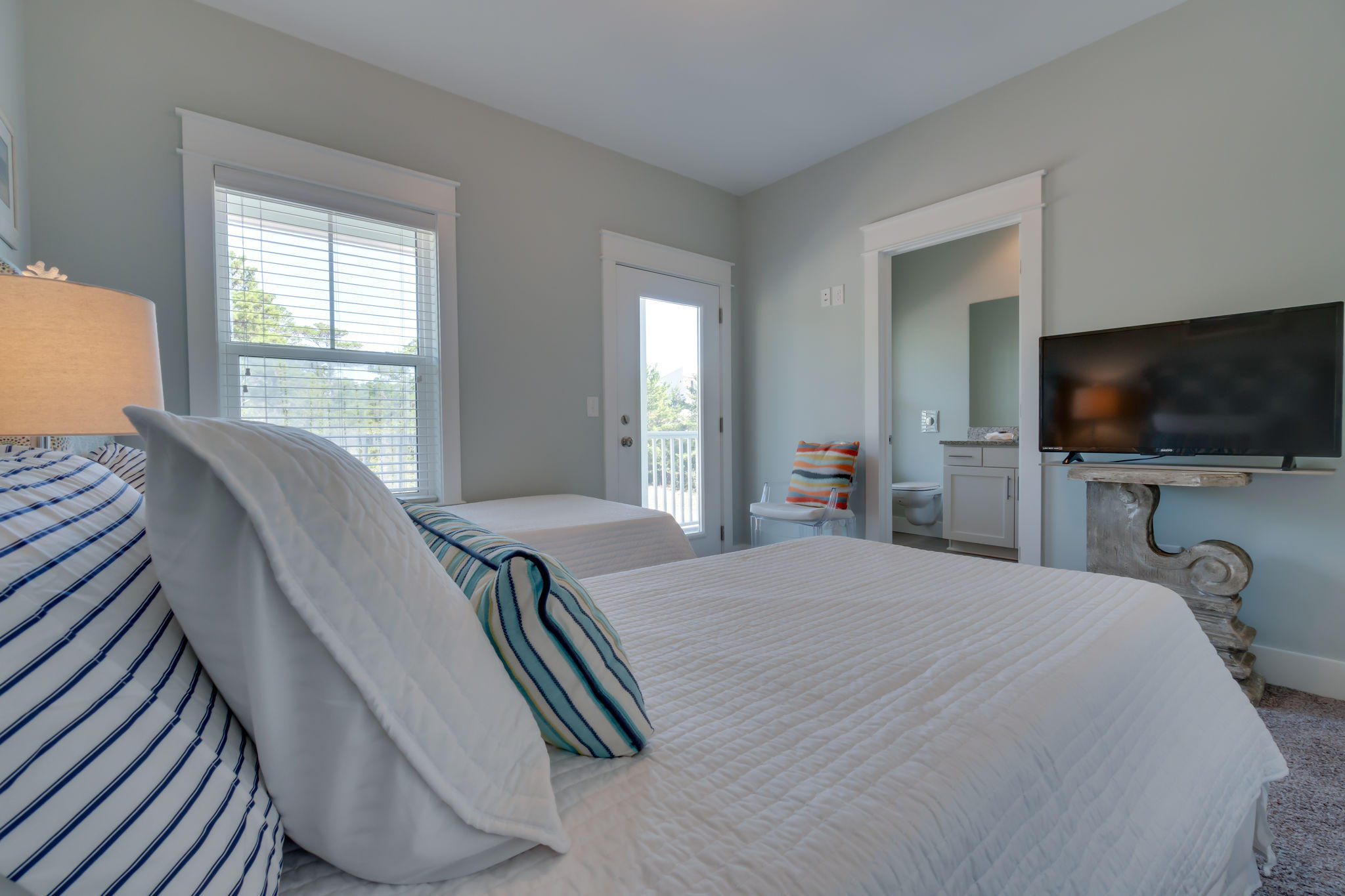 Lot 18 Beach View Dr Inlet Beach Inlet Beach, FL 32461 - Photo 29 of 41 a bedroom with a bed and a flat tv screen on dresser