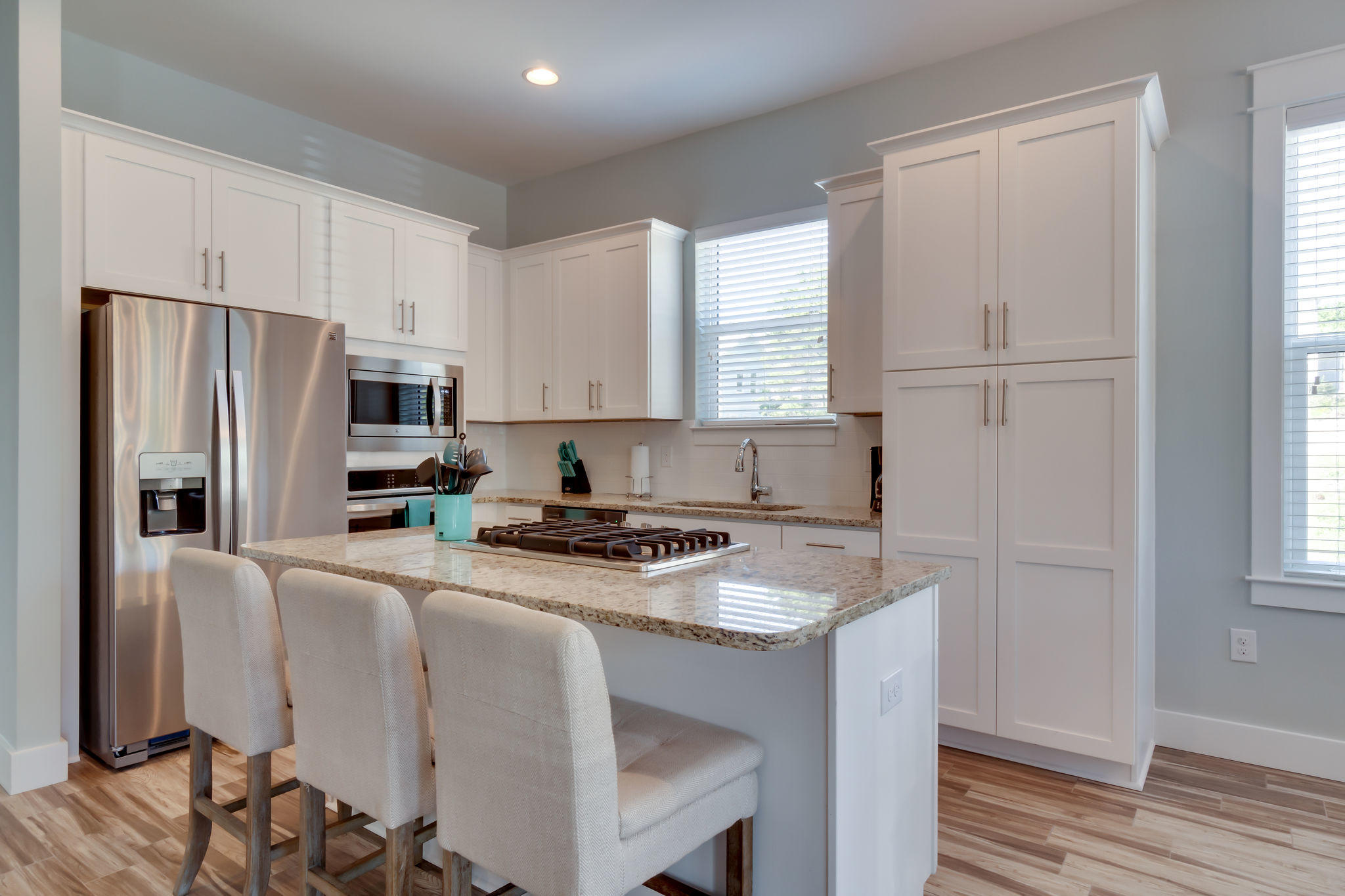 Lot 18 Beach View Dr Inlet Beach Inlet Beach, FL 32461 - Photo 10 of 41 a kitchen with stainless steel appliances granite countertop a refrigerator a stove a sink and white cabinets