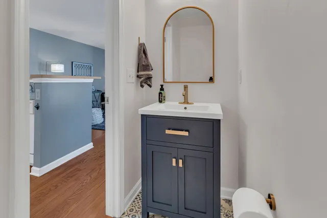 a bathroom with a sink and a mirror
