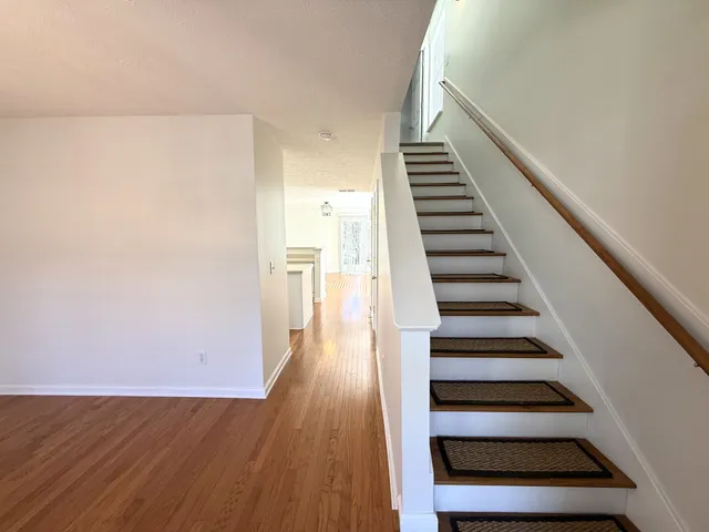 a view of entryway with wooden floor