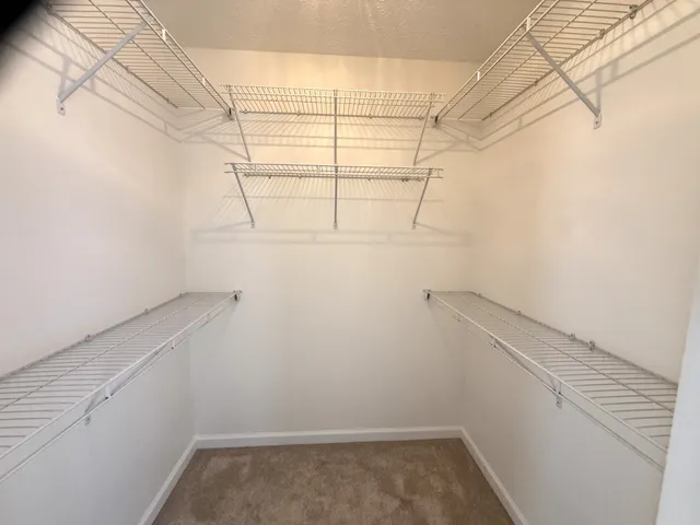 a view of a room with racks on the wall