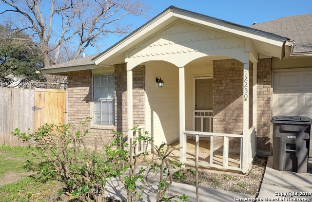 12250 Ridge Crown Street San Antonio, TX 78247 - Photo 1 of 15 a front view of a house with a glass door