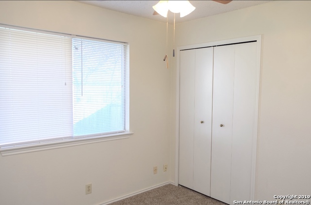 12250 Ridge Crown Street San Antonio, TX 78247 - Photo 13 of 15 a view of an empty room with a window