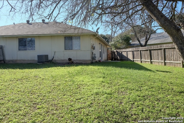 12250 Ridge Crown Street San Antonio, TX 78247 - Photo 15 of 15 a view of a house with a yard and a tree