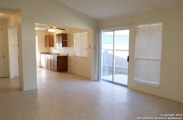 12250 Ridge Crown Street San Antonio, TX 78247 - Photo 6 of 15 a view of a big room with windows and cabinet