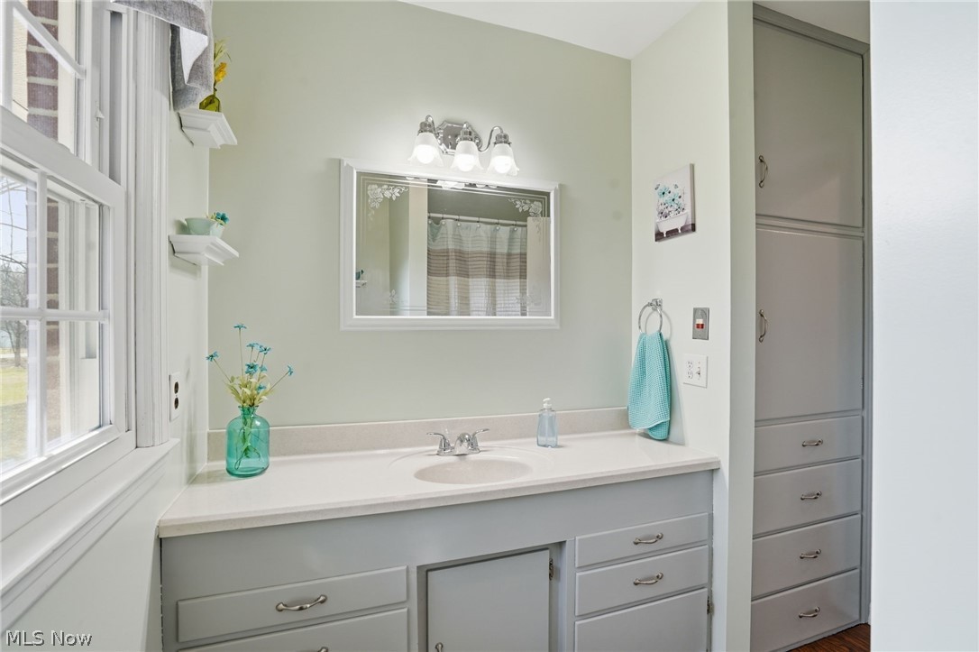 6655 Ceramic Road Crooksville, OH 43731 - Photo 22 of 34 Bathroom featuring vanity and curtained shower