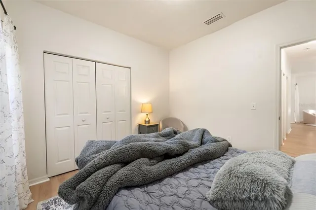 a bedroom with two beds and painted walls