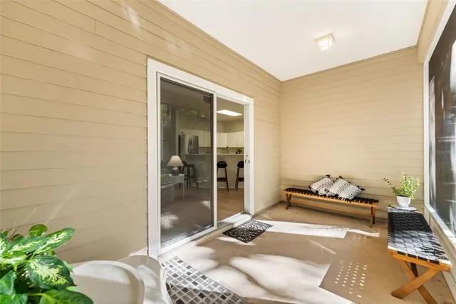 a backyard of a house with furniture