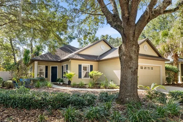 a front view of house with yard and green space