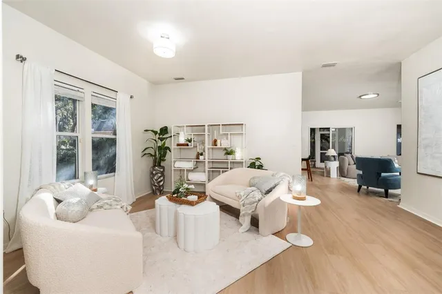 a living room with furniture and a table