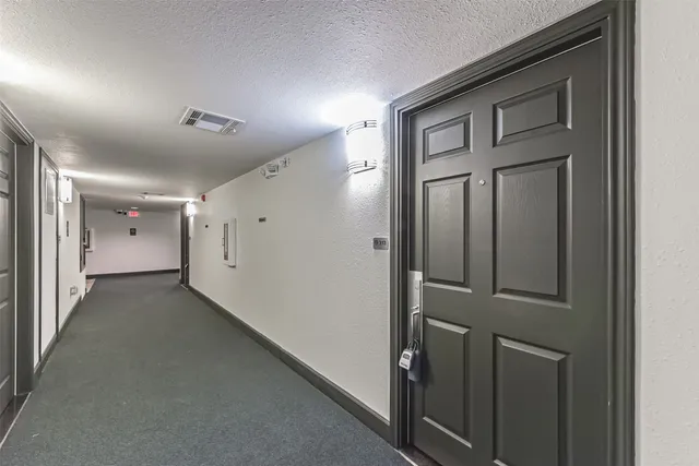 a view of a hallway with closet area