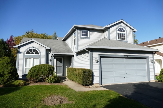 2052 Spice Circle Naperville, IL 60565 - Photo 1 of 1 a front view of a house with a yard and garage