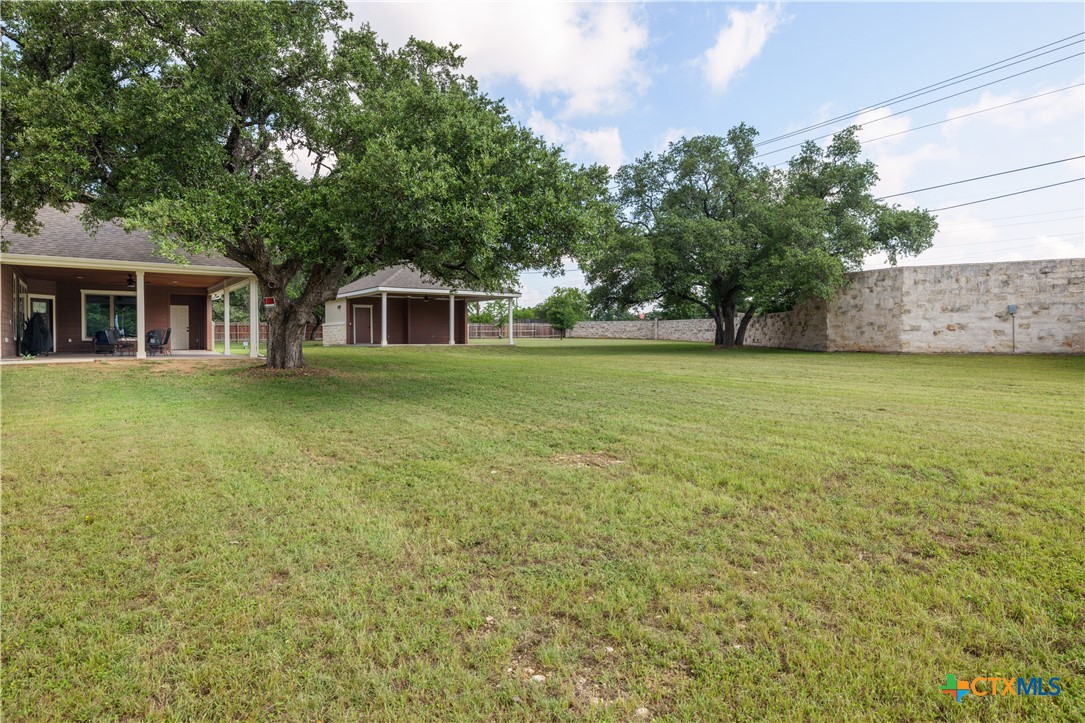 200 Wood Cove Georgetown, TX 78633 - Photo 6 of 22 a front view of a house with a garden