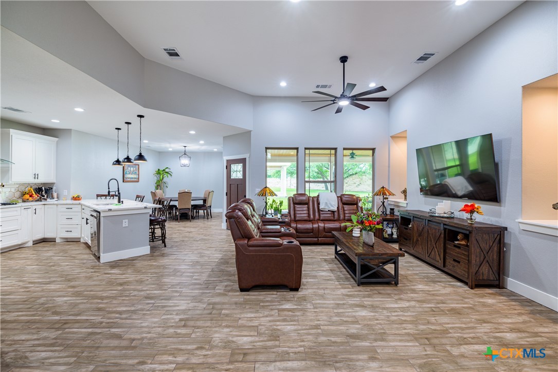 200 Wood Cove Georgetown, TX 78633 - Photo 10 of 22 a living room with furniture a flat screen tv and a large window