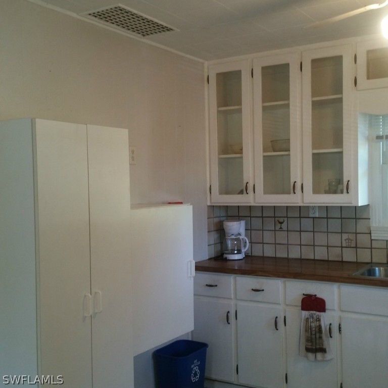 15272 Stringfellow Road Bokeelia, FL 33922 - Photo 12 of 21 a bathroom with a sink and a window