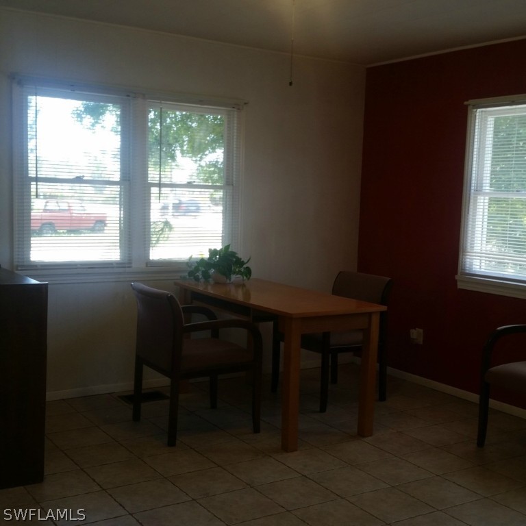 15272 Stringfellow Road Bokeelia, FL 33922 - Photo 9 of 21 a view of a workspace with furniture and a window