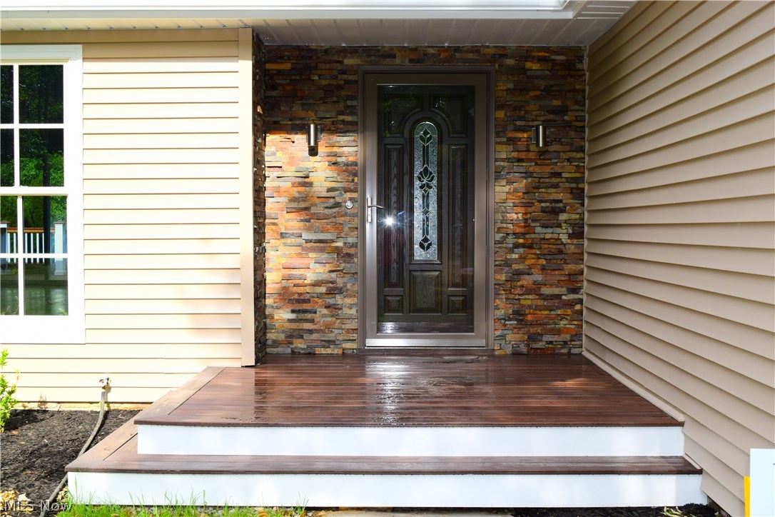 6835 Liberty Road Solon, OH 44139 - Photo 12 of 33 Front entry with a new porch, front door and stone decoration