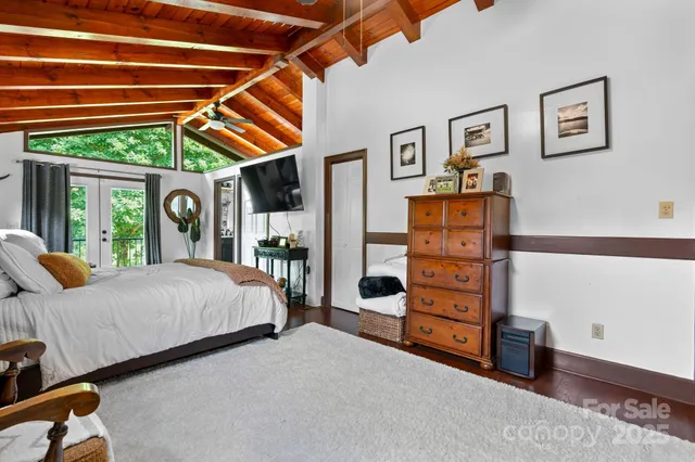 a bed room with a bed and a window