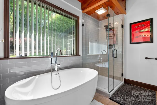 a bathroom with a granite countertop sink a toilet and a bathtub