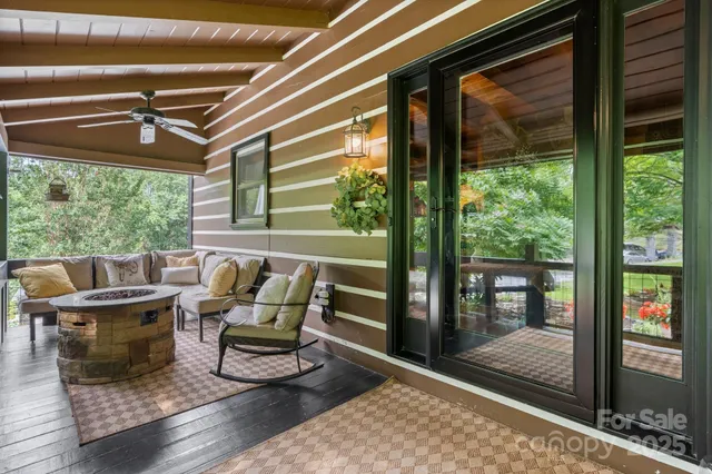 a outdoor living space with furniture and a floor to ceiling window