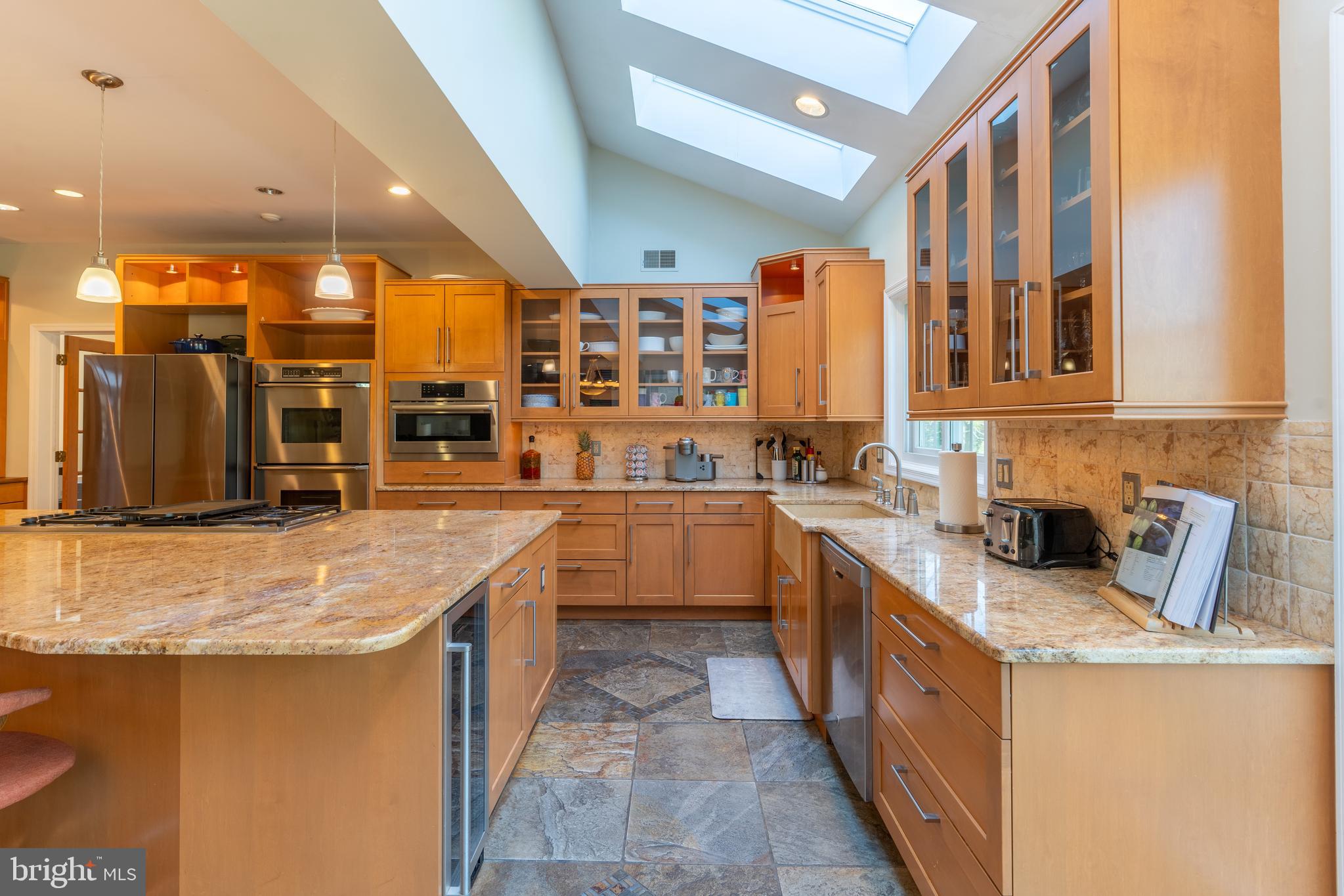 925 Morgan Road Jenkintown, PA 19046 - Photo 15 of 83 a kitchen with stainless steel appliances granite countertop a sink and cabinets
