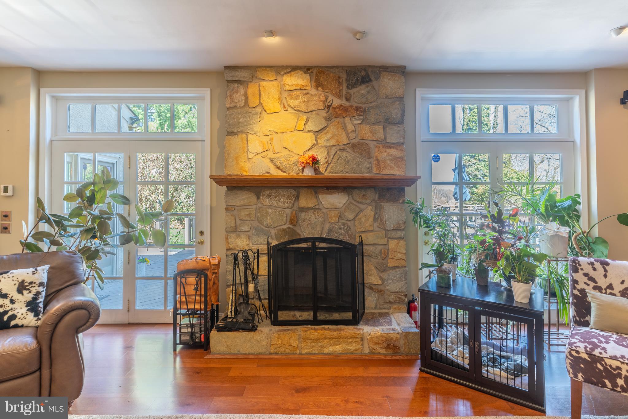 925 Morgan Road Jenkintown, PA 19046 - Photo 26 of 83 a living room with furniture a fireplace and a large window