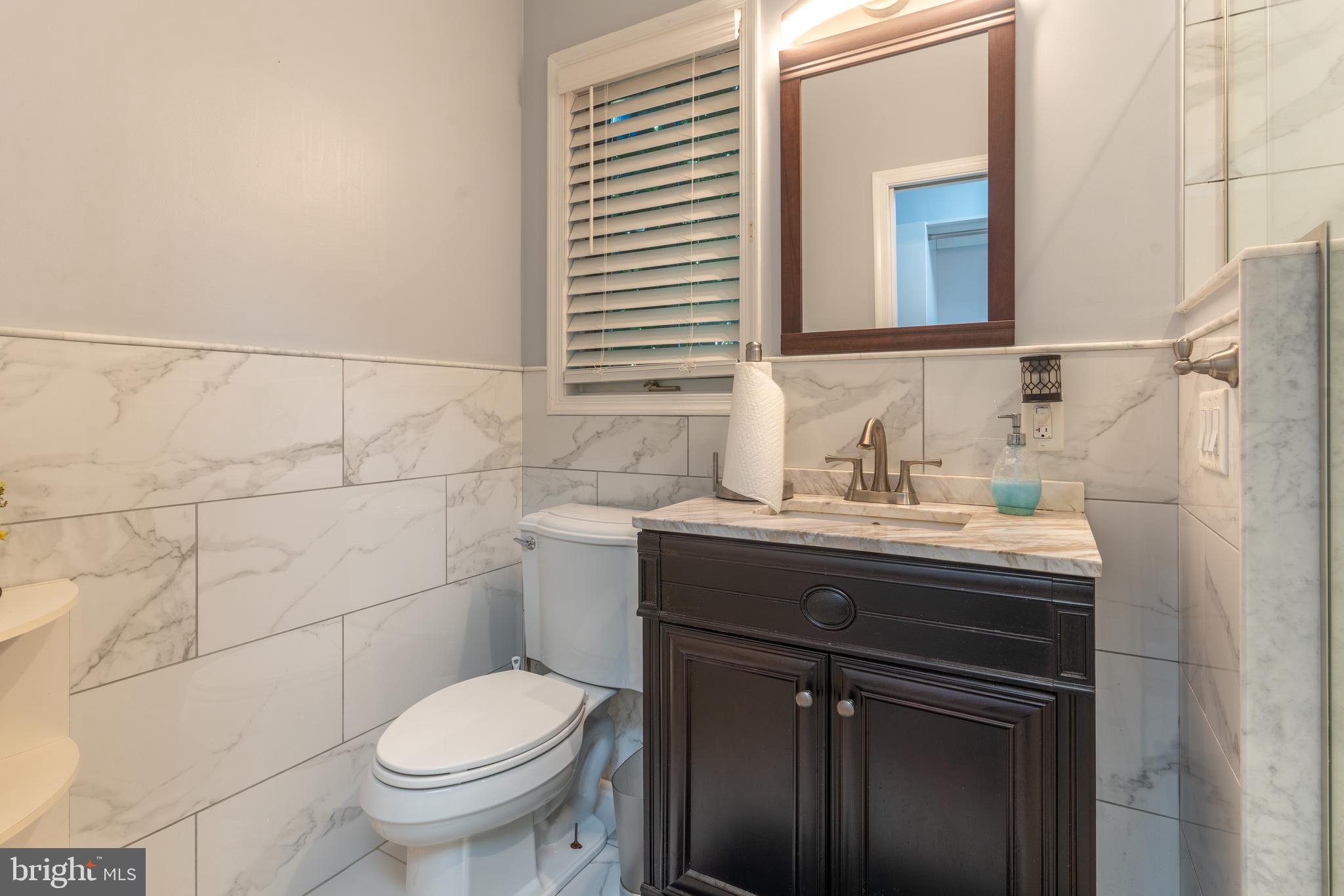 925 Morgan Road Jenkintown, PA 19046 - Photo 36 of 83 a bathroom with a sink toilet and mirror