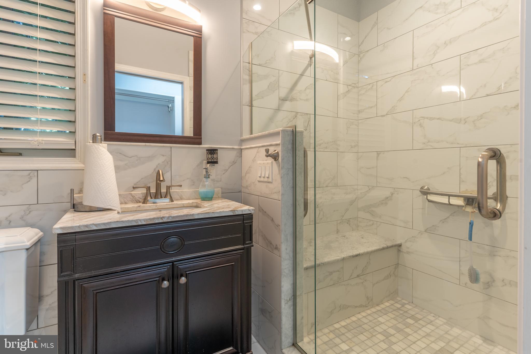 925 Morgan Road Jenkintown, PA 19046 - Photo 37 of 83 a bathroom with a sink and a mirror