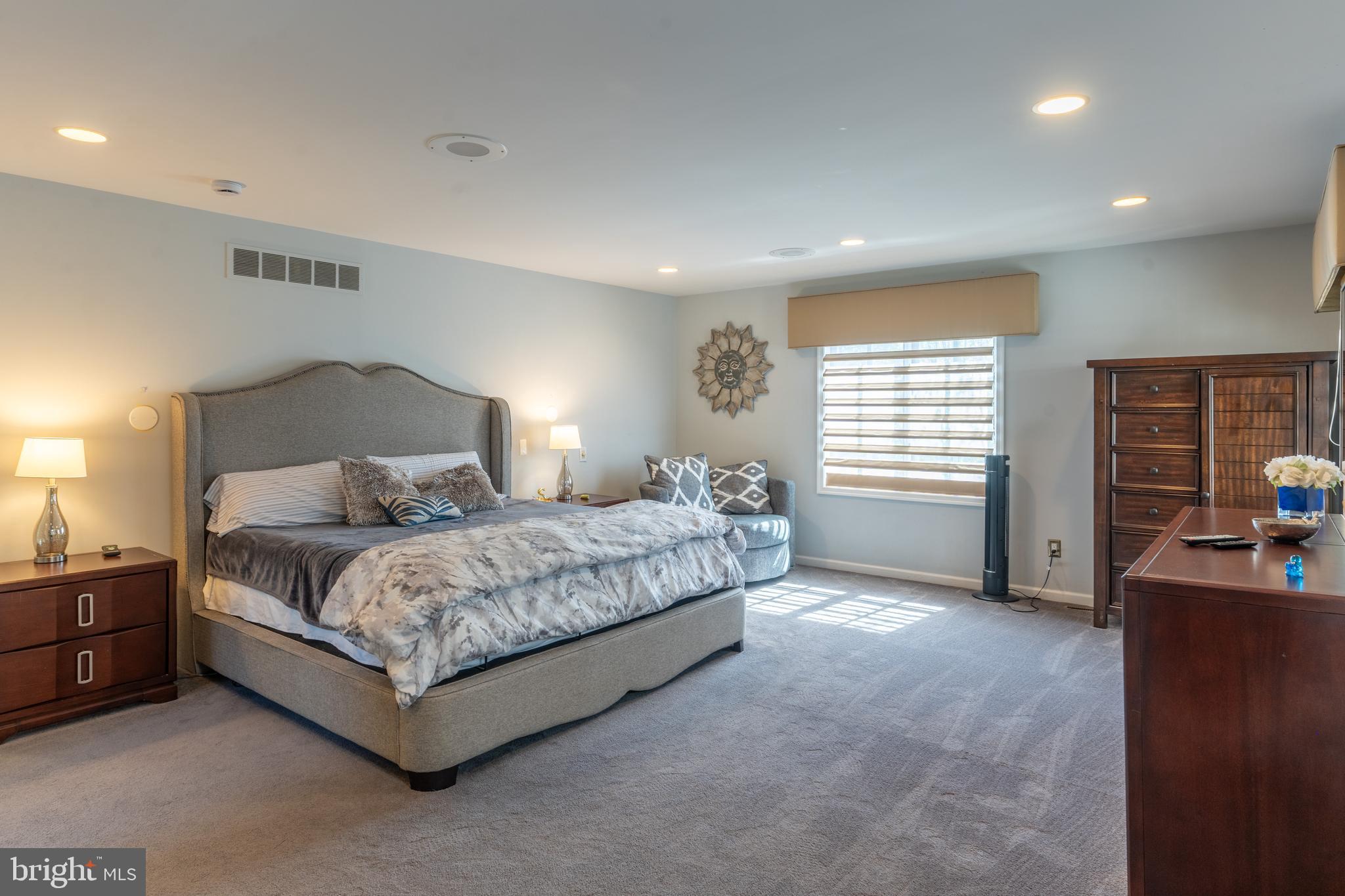 925 Morgan Road Jenkintown, PA 19046 - Photo 50 of 83 a spacious bedroom with a bed and a cabinets