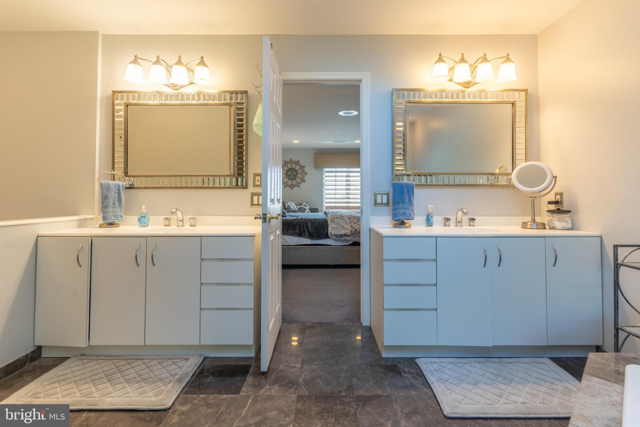 925 Morgan Road Jenkintown, PA 19046 - Photo 59 of 83 a en suite bathroom with double sink and a mirror