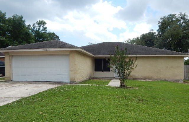 6402 Brookgate Drive Spring, TX 77373 - Photo 1 of 17 a front view of house with yard and garage