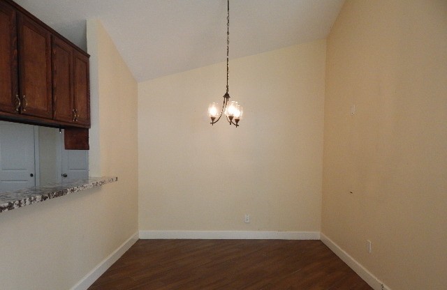 6402 Brookgate Drive Spring, TX 77373 - Photo 8 of 17 a view of a storage and utility room with wooden floor