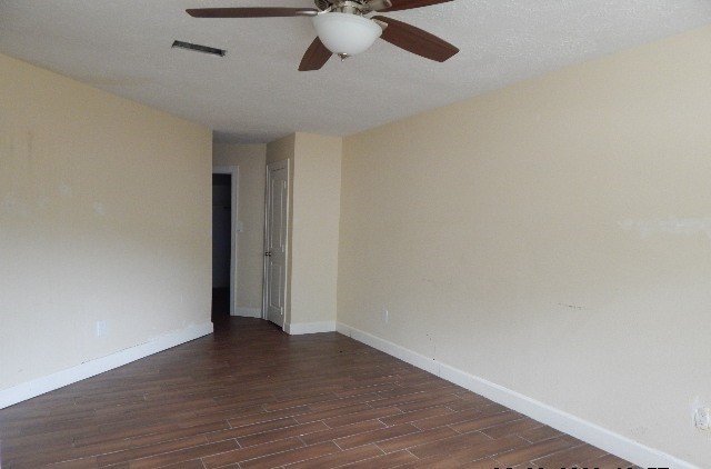6402 Brookgate Drive Spring, TX 77373 - Photo 9 of 17 a view of an empty room with wooden floor