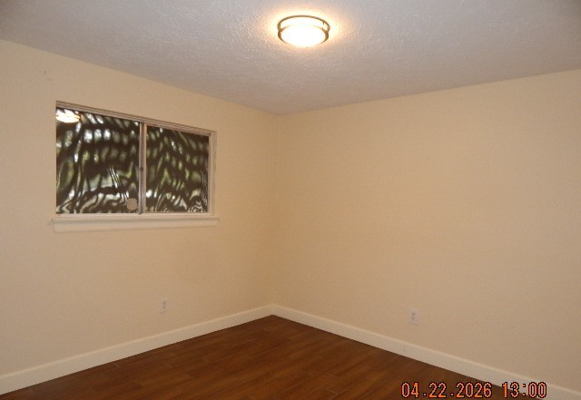 6402 Brookgate Drive Spring, TX 77373 - Photo 10 of 17 a view of an empty room with wooden floor and a window