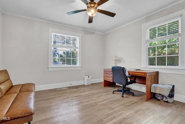 a workspace with furniture and a window