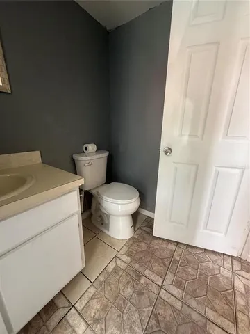 a bathroom with a toilet and a sink