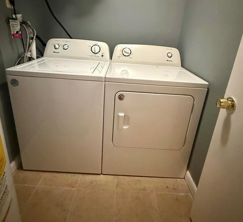 1019 West Sumner Street Kissimmee, FL 34741 - Photo 9 of 12 a utility room with dryer and washer