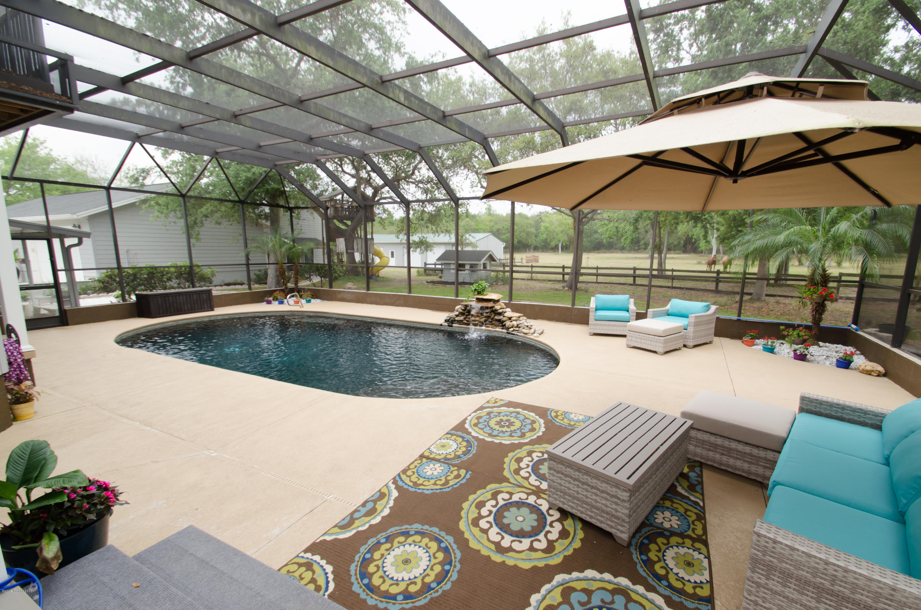 3100 Davis Road Mims, FL 32754 - Photo 12 of 54 Screened Lagoon Style Pool Area