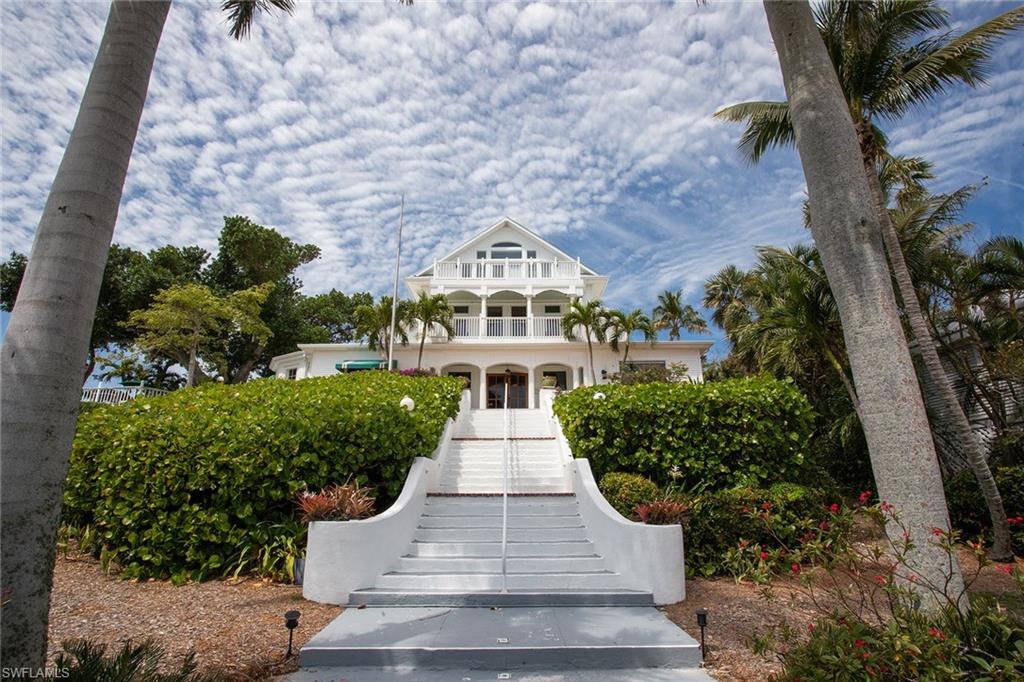143 Useppa Island Bokeelia, FL 33922 - Photo 19 of 22 View of front of house with stairway and covered porch
