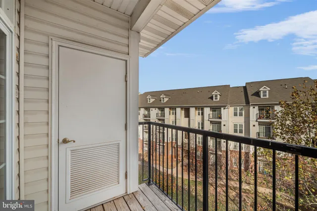 a view of a balcony with wooden floor
