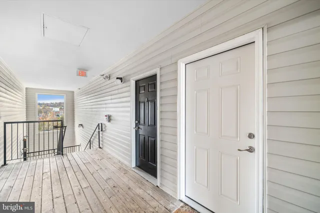 a very nice looking room with wooden floor and staircase
