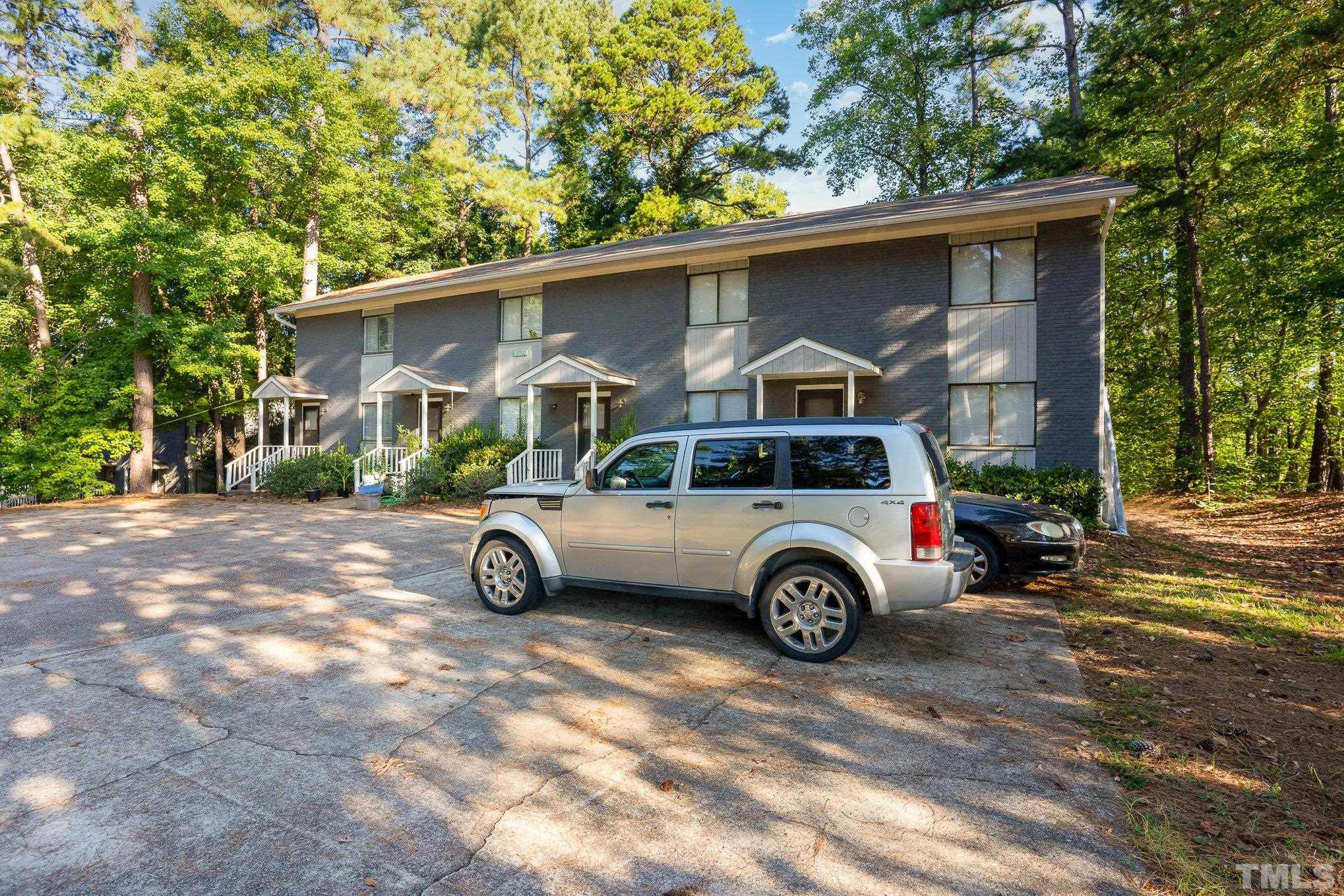 3700 Greenleaf Street Raleigh, NC 27606 - Photo 3 of 13 a car parked in front of a house