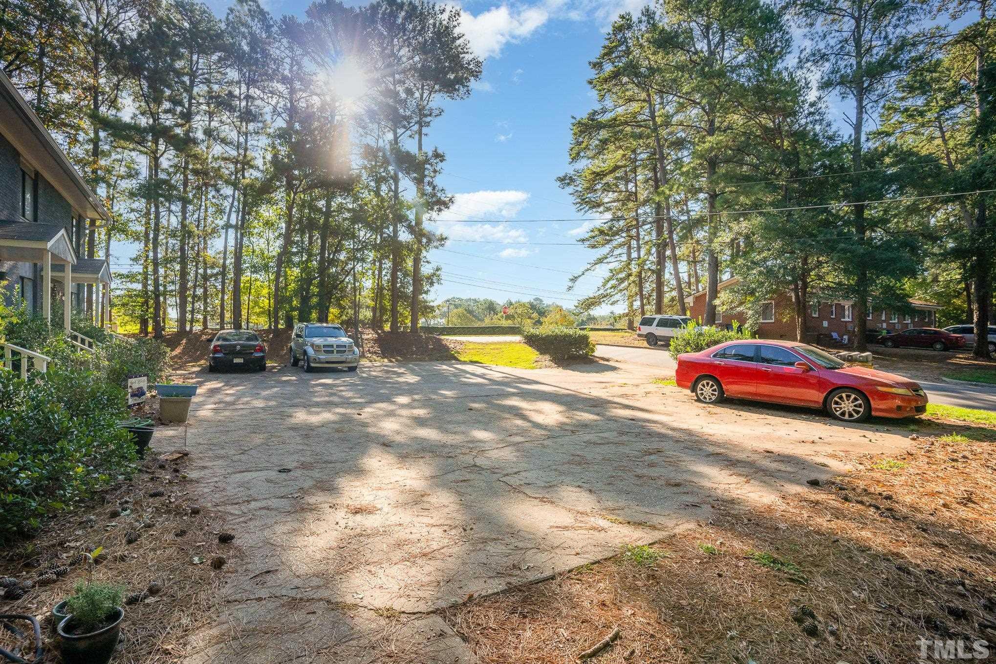3700 Greenleaf Street Raleigh, NC 27606 - Photo 4 of 13 a view of street with parked cars