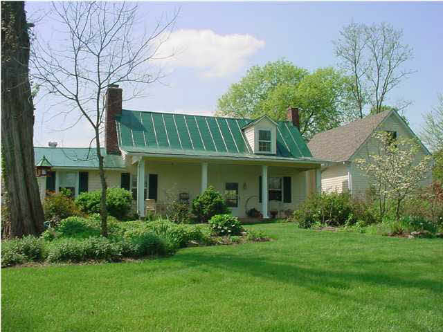 1110 Venable Road Palmyra, VA 22963 - Photo 1 of 5 a front view of a house with garden